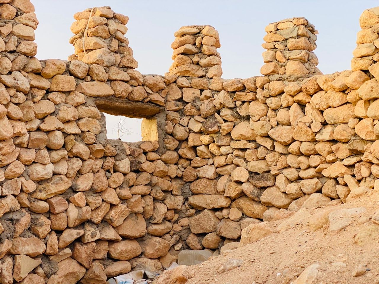 Close view of historic stone walls at a Waddan heritage site.